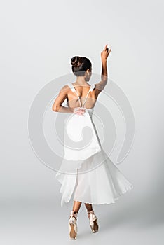 Young african american ballerina isolated on