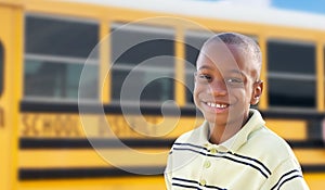 Young African American Boy Near School Bus