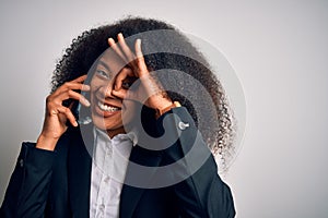 Young african american business woman with afro hair calling using smartphone mobile with happy face smiling doing ok sign with