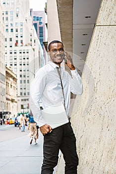 Young African American businessman with beard traveling, working in New York