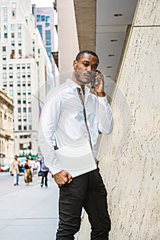 Young African American businessman with beard traveling, working in New York