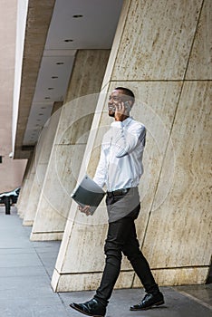 Young African American businessman with beard traveling, working in New York