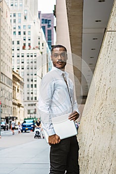 Young African American businessman with beard traveling, working in New York