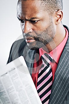 Young African American Businessman Being Sneaky On Laptop