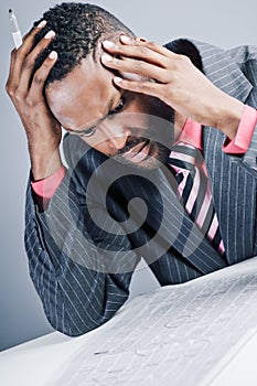 Young African American Businessman Being Sneaky On Laptop