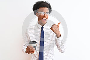 Young african american businessman drinking cup of coffee over isolated white background pointing and showing with thumb up to the