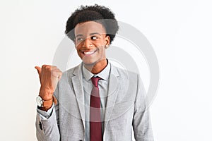 Young african american businessman wearing suit standing over isolated white background smiling with happy face looking and