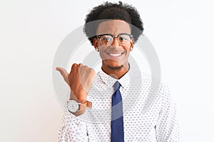 Young african american businessman wearing tie and glasses over isolated white background smiling with happy face looking and