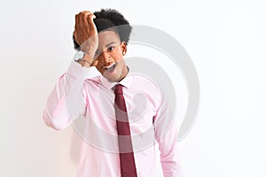Young african american businessman wearing tie standing over isolated white background surprised with hand on head for mistake,