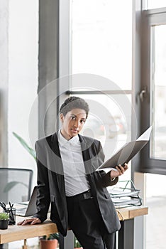 young african american businesswoman holding folder