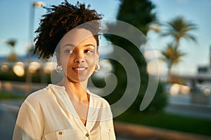 Young african american businesswoman smiling happy standing at the city