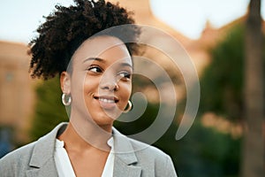 Young african american businesswoman smiling happy standing at the park