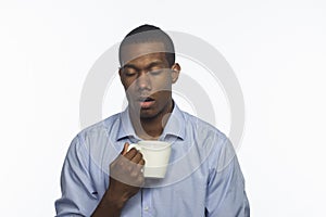 Young African American with coffee mug, horizontal