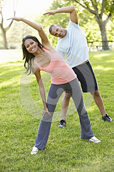 Young African American Couple Exercising In Park