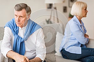 Young african-american couple quarreling at home, offended at each other . Family relationship difficulties concept