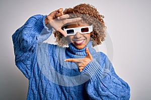 Young african american curly woman wearing 3d glasses over isolated white background smiling making frame with hands and fingers