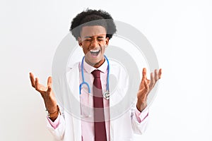 Young african american doctor man wearing sthetoscope over isolated white background celebrating mad and crazy for success with