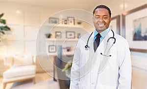 Young African American Doctor or Nurse Standing in His Office