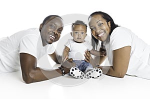 Young African American family in the studio with baby toddler son