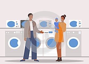 Young african american family will choose washing machine in a shopping center of household appliances supermarket