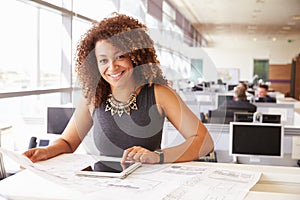 Young African American female architect working in an office