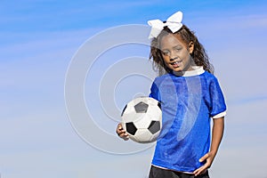 Young african american girl soccer player with copy space