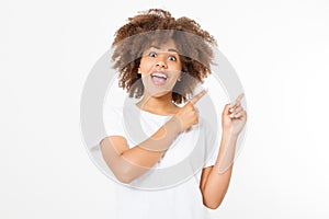 Young african american happy woman showing copyspace pointing on white background. Summer fun. Afro curly hairstyle