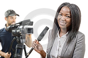 Young African american journalist with a microphone and a camera