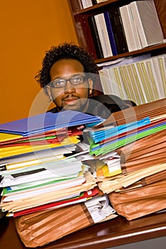 Young African American Male Buried in Work