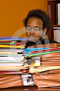 Young African American Male Buried in Work