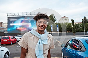 Young african american man on autocinema screen background