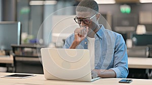 Young African American Man Coughing at Workin Office