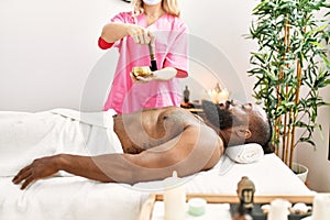 Young african american man having aromatherapy treatment at beauty center