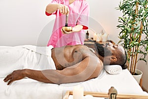 Young african american man having aromatherapy treatment at beauty center