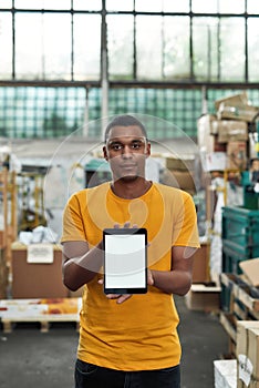 Young african american man holding digital tablet