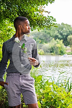 Young African American Man missing you and waiting for you at Central Park in New York