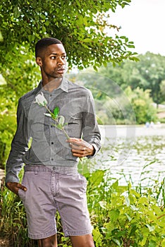 Young African American Man missing you and waiting for you at Central Park in New York