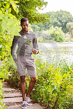 Young African American Man missing you and waiting for you at Central Park in New York