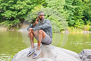 Young African American Man relaxing at Central Park in New York