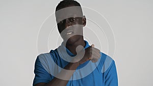 Young African American man threatening on camera looking dangerous isolated on white background. You in deep trouble