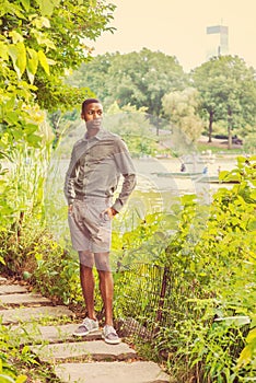 Young African American Man waiting for you at Central Park in New York