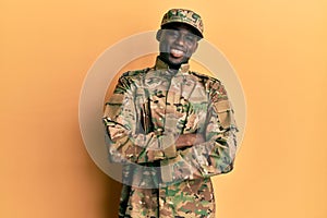 Young african american man wearing army uniform happy face smiling with crossed arms looking at the camera