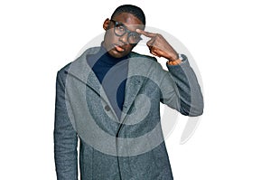 Young african american man wearing business clothes and glasses pointing unhappy to pimple on forehead, ugly infection of