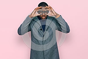 Young african american man wearing business clothes and glasses trying to open eyes with fingers, sleepy and tired for morning