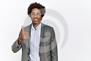 Young african american man wearing business jacket over isolated white background smiling happy and positive, thumb up doing