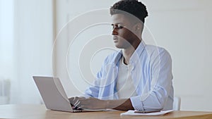 Young african american manager relaxing at workplace
