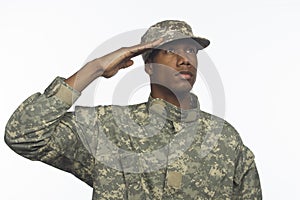 Young African American military man saluting, horizontal