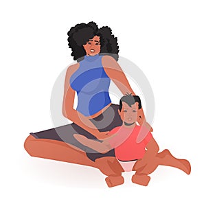 Young african american mother playing with newborn baby happy family spending time together motherhood concept