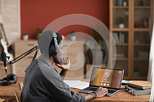 Young African-American Musician Composing at Home