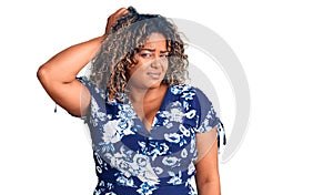 Young african american plus size woman wearing casual clothes confuse and wonder about question